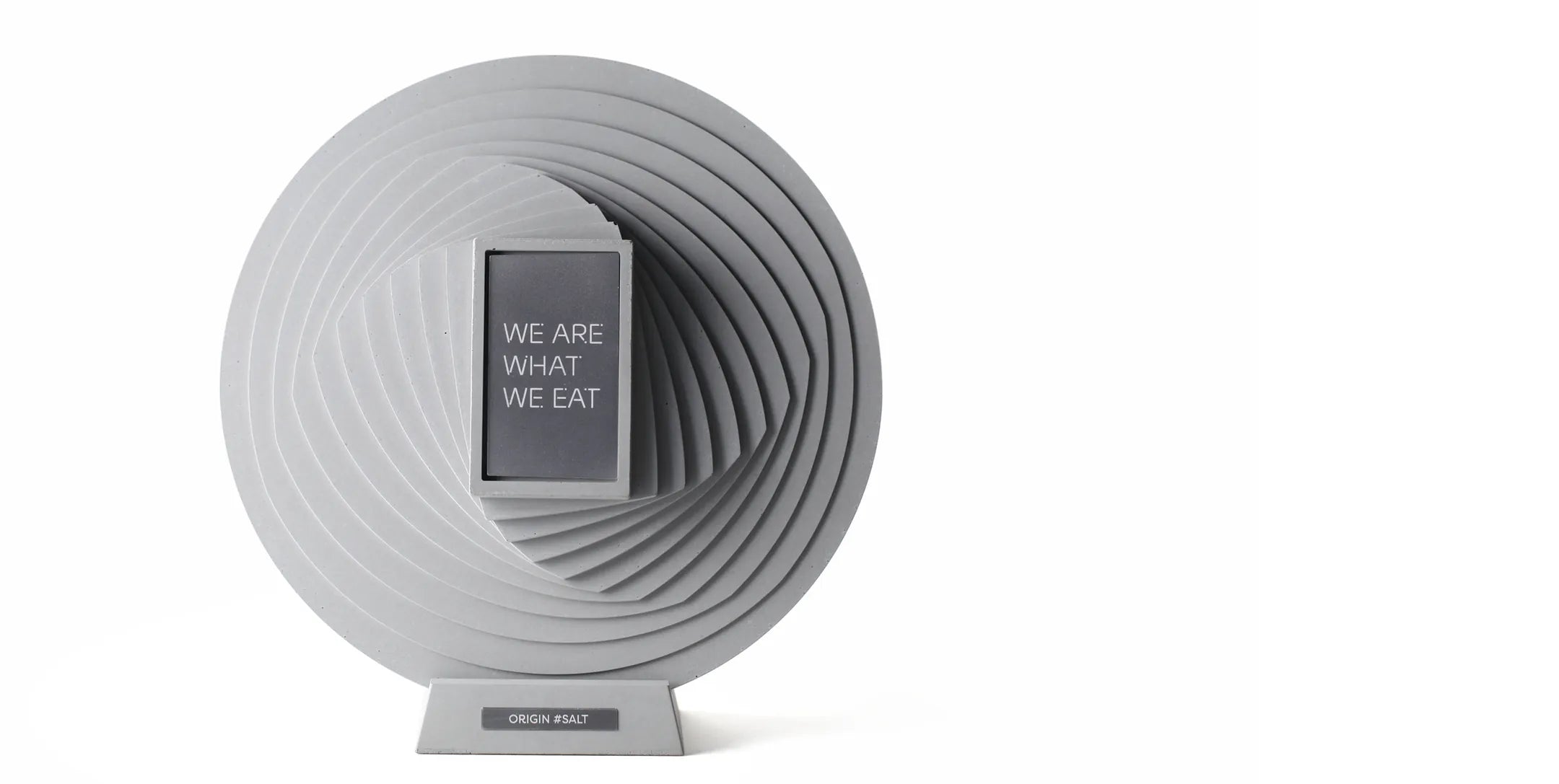 Bespoke sculptural award by 22STUDIO, designed for high-impact corporate gifting and deal toy presentations. Featuring a spiral form with the message “WE ARE WHAT WE EAT,” this piece blends conceptual design with premium craftsmanship—ideal for finance tombstones, milestone recognition, and NFT-linked commemoratives.